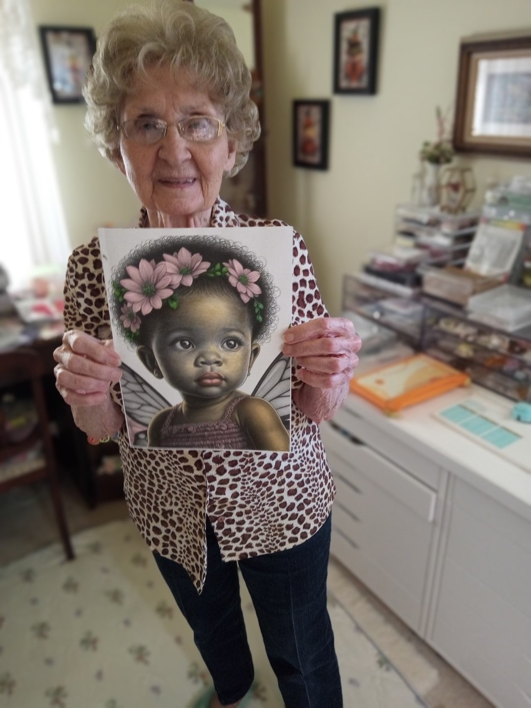 Artist holding her art from Fairyling Whispers Coloring Book